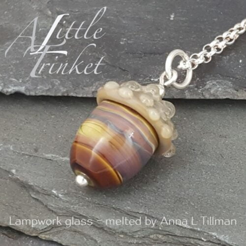 Glass acorn pendant on a sterling silver chain