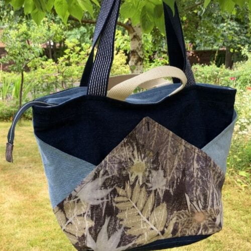 Attractive tote bag with four external pockets made from upcycled denim jeans and botanically printed upcycled linen.