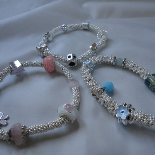 Handmade charm bracelet, pink, blue and silver