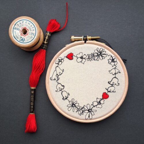 Gemma Rappensberger illustration of flowers making a shape of a heart with 2 embroidered hearts.